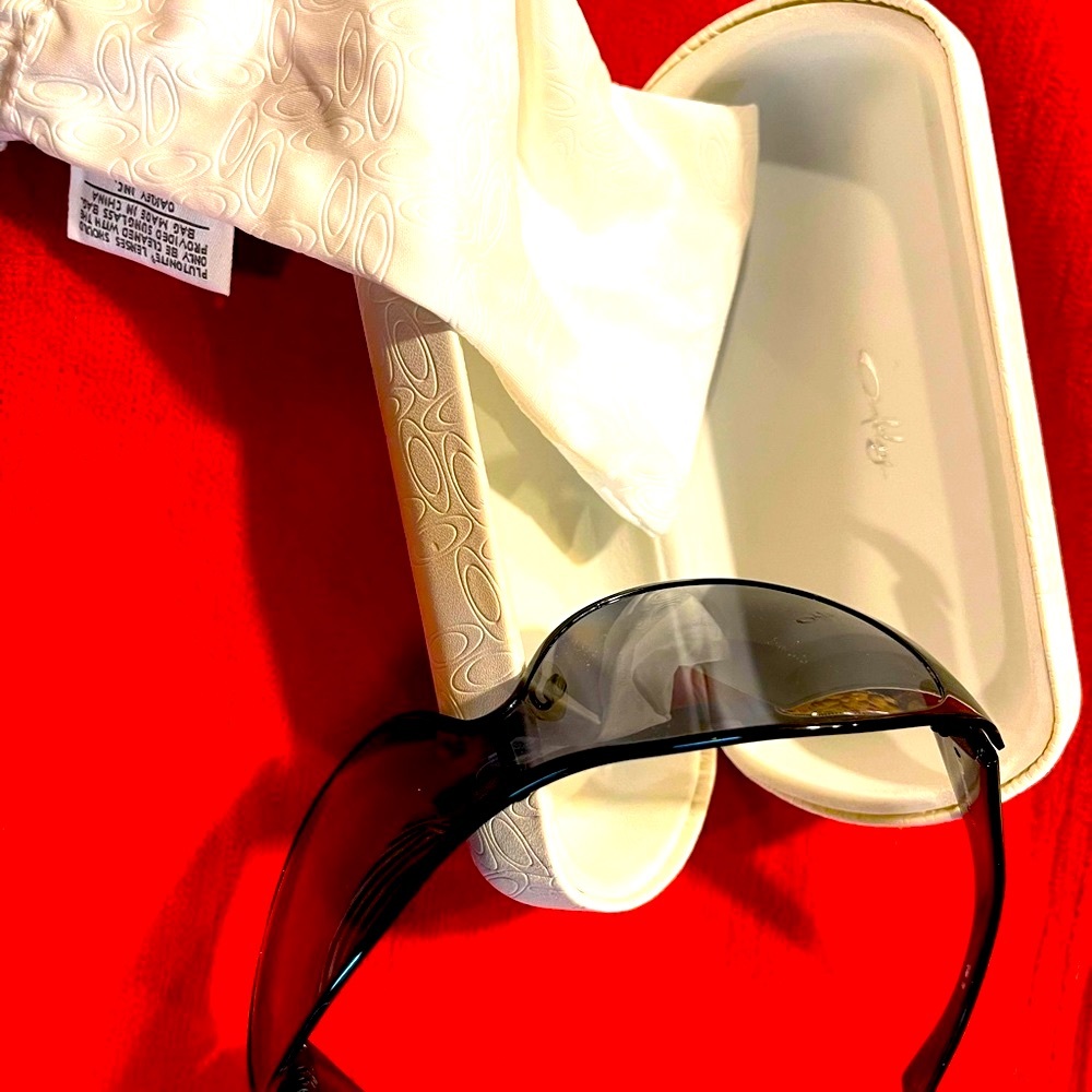 Brand new condition Breathless Oakley sunglasses in Black. Polarized lenses.